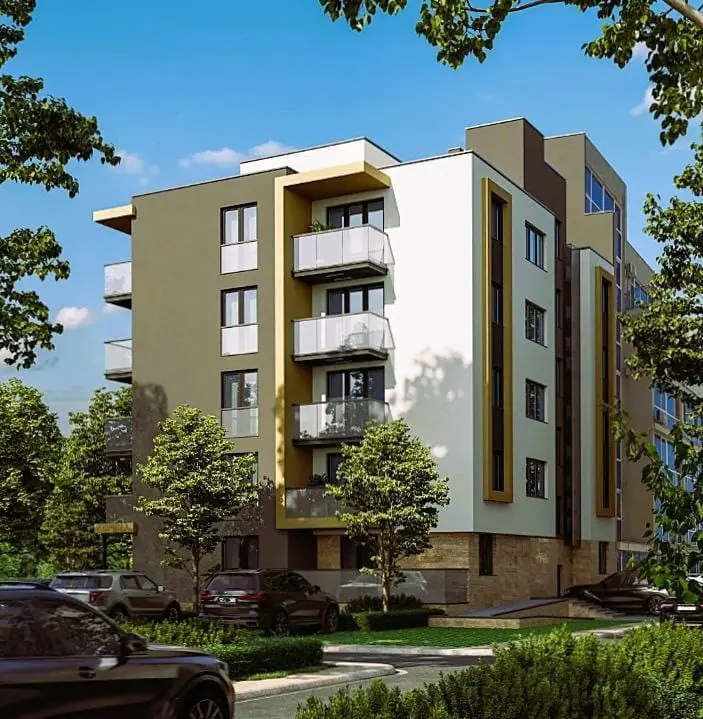 Современный трехкомнатный апартамент с балконами в комплексе City v2, окруженный зелеными насаждениями и парковкой.