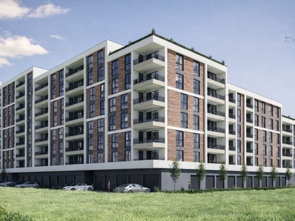 Современный жилой комплекс с балконами, окружённый зеленью и паркингом, идеальный для покупки недвижимости в Болгарии.