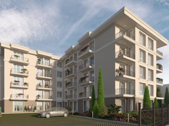 Современный жилой комплекс в Болгарии с балконами, зелеными насаждениями и парковкой, идеальный для покупки недвижимости.